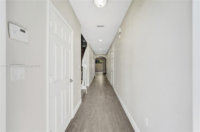 corridor featuring hardwood / wood-style flooring