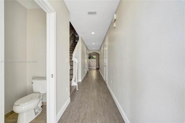 hallway with light hardwood / wood-style flooring