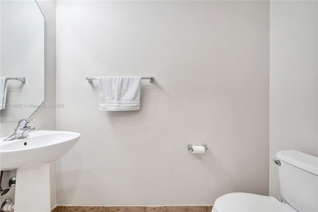 bathroom with sink and toilet