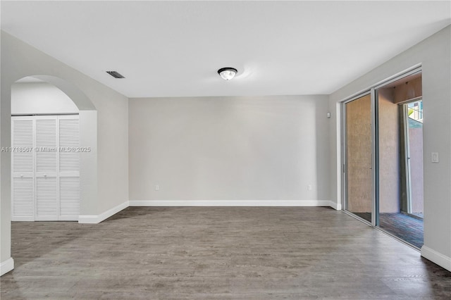 unfurnished room featuring hardwood / wood-style floors