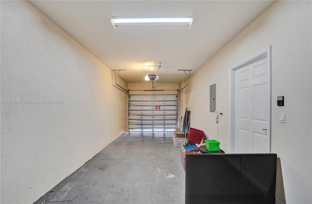 garage featuring a garage door opener and electric panel