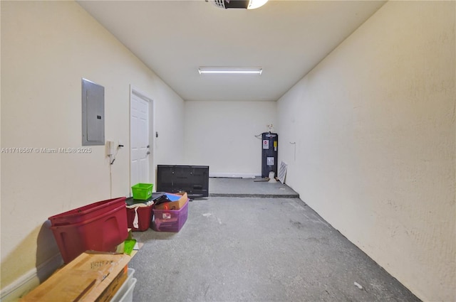 interior space featuring electric panel, water heater, and concrete flooring