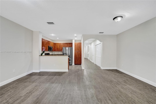 unfurnished living room with hardwood / wood-style flooring