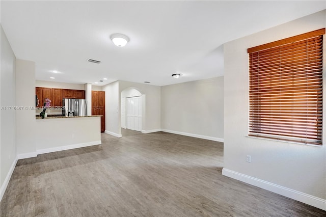 unfurnished living room with light hardwood / wood-style flooring