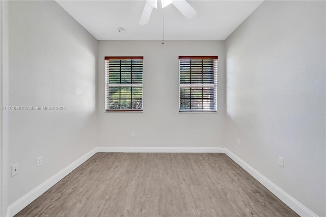 spare room with ceiling fan and light hardwood / wood-style flooring