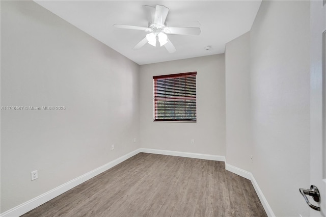 empty room with hardwood / wood-style flooring and ceiling fan