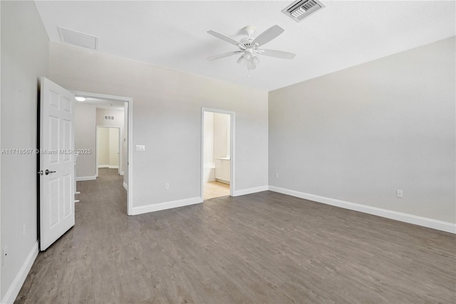 unfurnished bedroom featuring ensuite bath, ceiling fan, and light wood-type flooring