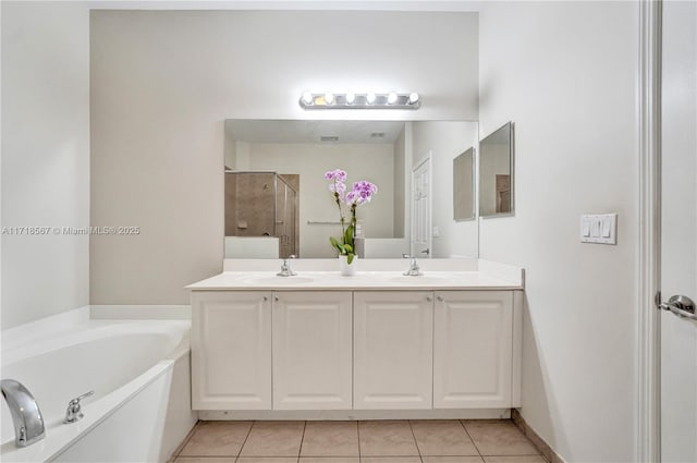 bathroom featuring separate shower and tub, tile patterned flooring, and vanity