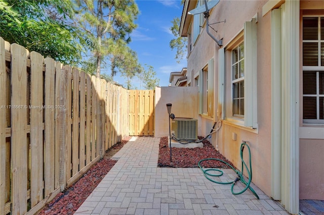 view of patio with central AC