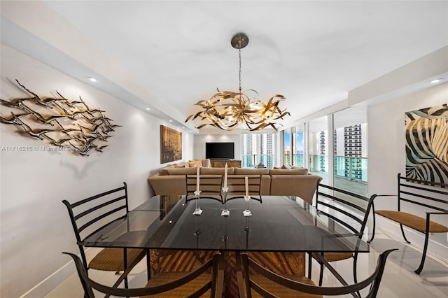 dining area with expansive windows and a chandelier