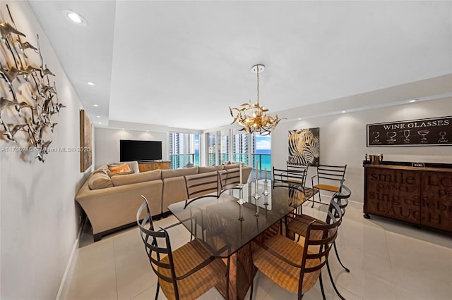 dining area with a notable chandelier and light tile patterned flooring