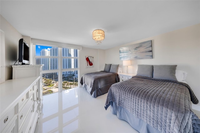 tiled bedroom with floor to ceiling windows