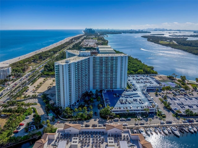 aerial view featuring a view of the beach and a water view