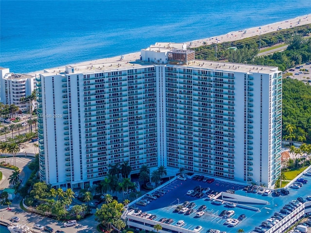 view of building exterior with a water view and central air condition unit