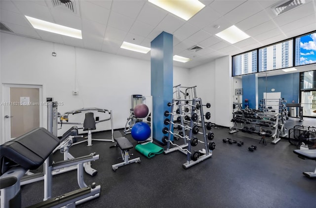 exercise room featuring a paneled ceiling