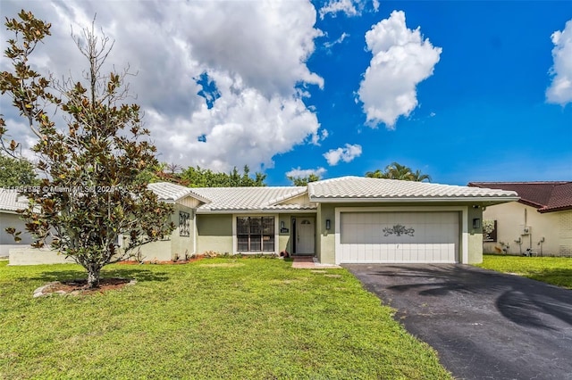 ranch-style home with a garage and a front lawn