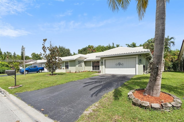 single story home featuring a front yard and a garage