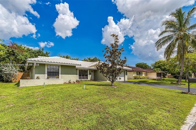 ranch-style home with a front lawn