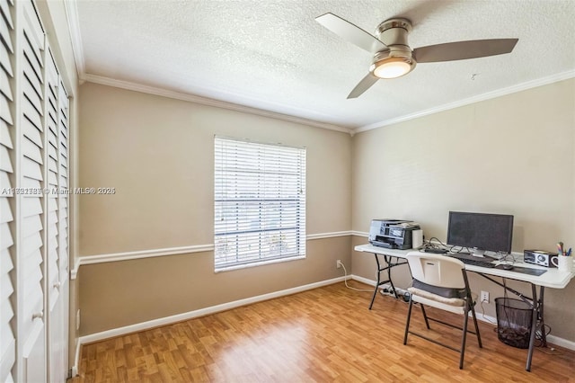 office space with a textured ceiling, ceiling fan, wood-type flooring, and ornamental molding