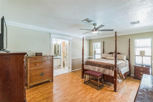 bedroom featuring connected bathroom, ceiling fan, light hardwood / wood-style flooring, crown molding, and multiple windows