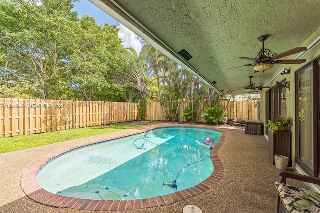 view of swimming pool featuring ceiling fan