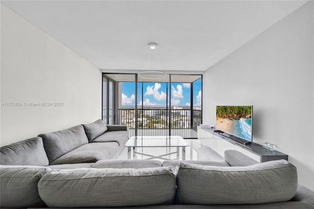 living room featuring floor to ceiling windows