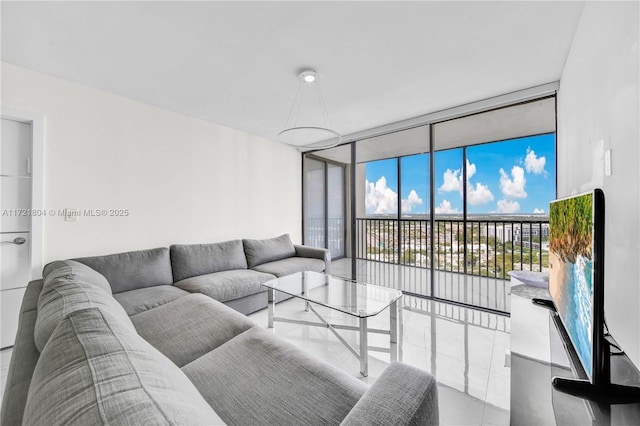 tiled living room with expansive windows and a healthy amount of sunlight