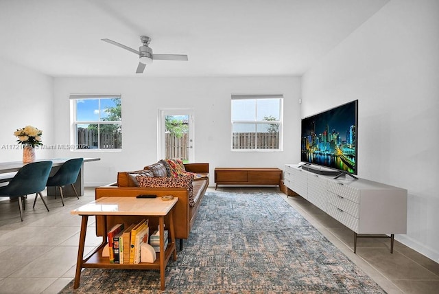 tiled living room featuring ceiling fan