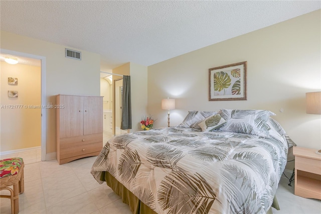 tiled bedroom with a textured ceiling