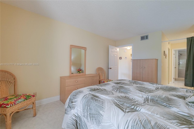 bedroom featuring a textured ceiling