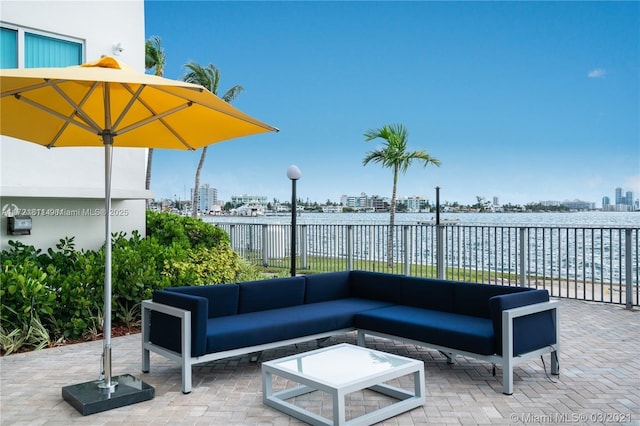 view of patio / terrace with a water view and an outdoor hangout area