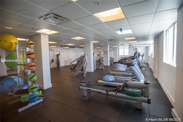 exercise room with a drop ceiling