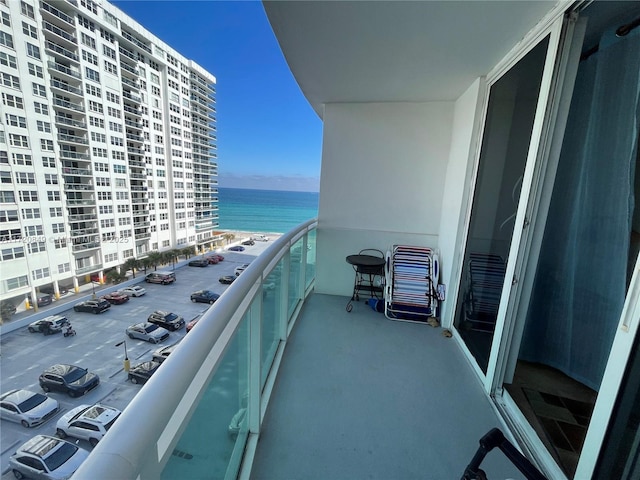 balcony featuring a water view