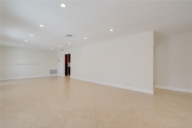 empty room with light tile patterned flooring