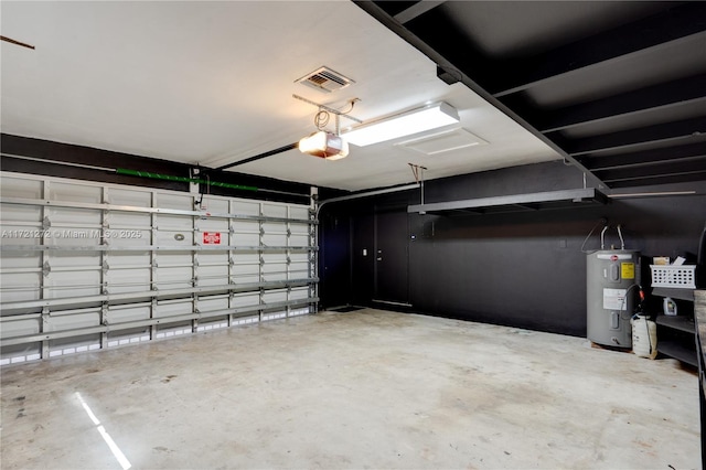 garage with electric water heater and a garage door opener