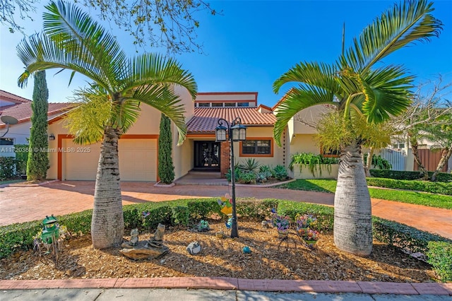 mediterranean / spanish-style home featuring a garage