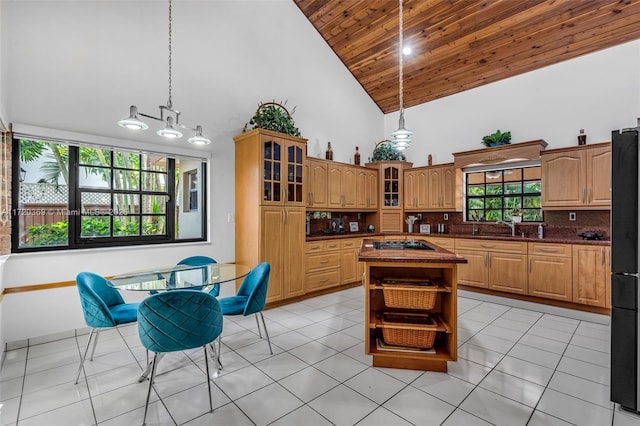 kitchen with decorative backsplash, high vaulted ceiling, wooden ceiling, a kitchen island, and hanging light fixtures