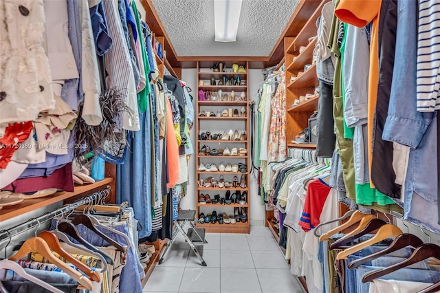 spacious closet with light tile patterned flooring