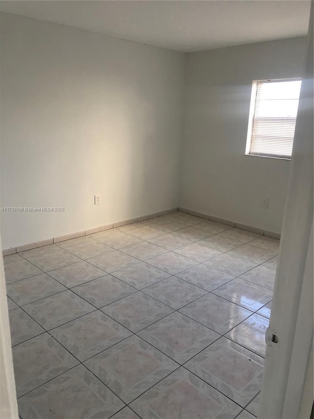 view of tiled spare room