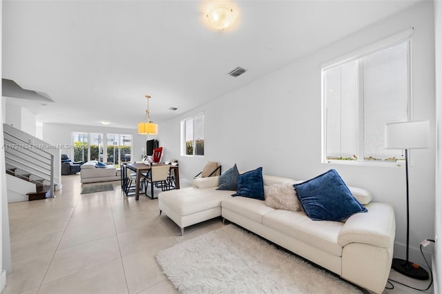 living room with light tile patterned floors