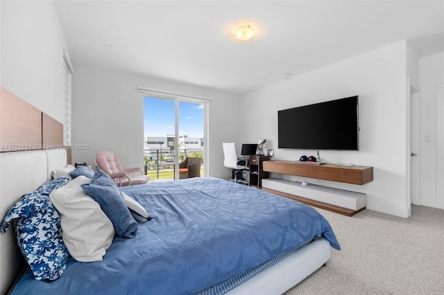 bedroom featuring carpet and access to outside