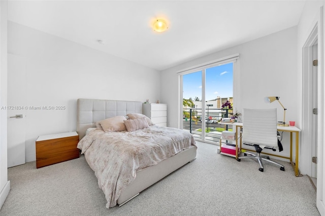 bedroom featuring access to outside and light carpet