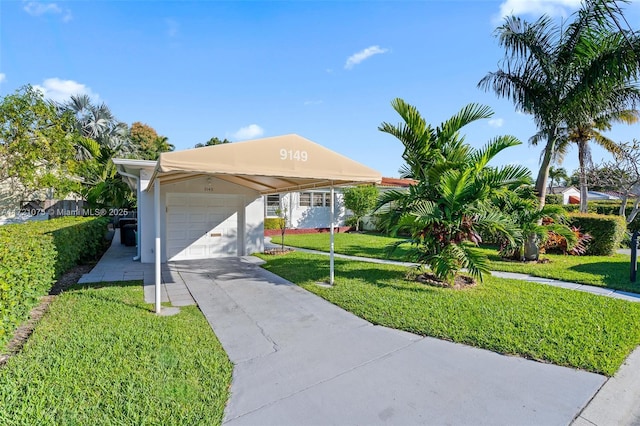 view of front of house featuring a front yard and a garage