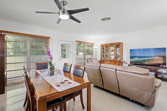 dining space with ceiling fan