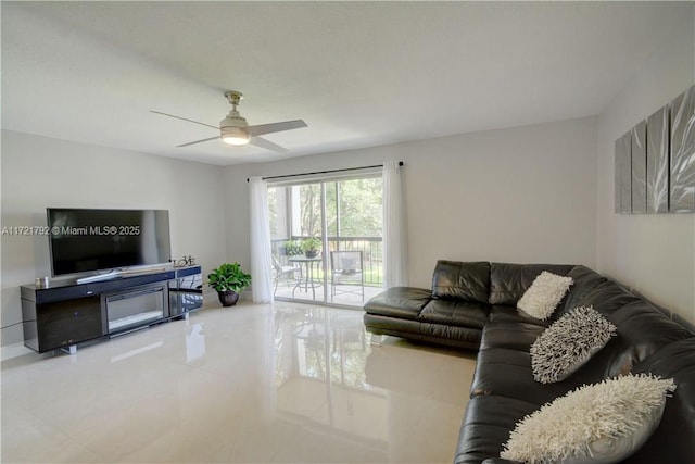 tiled living room with ceiling fan