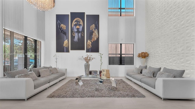 living room featuring a high ceiling and an inviting chandelier