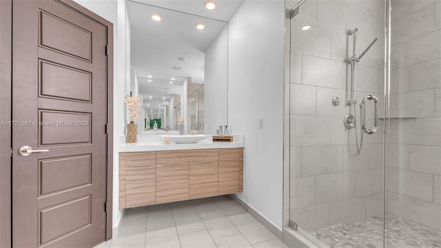 bathroom featuring vanity, tile patterned floors, and a shower with door