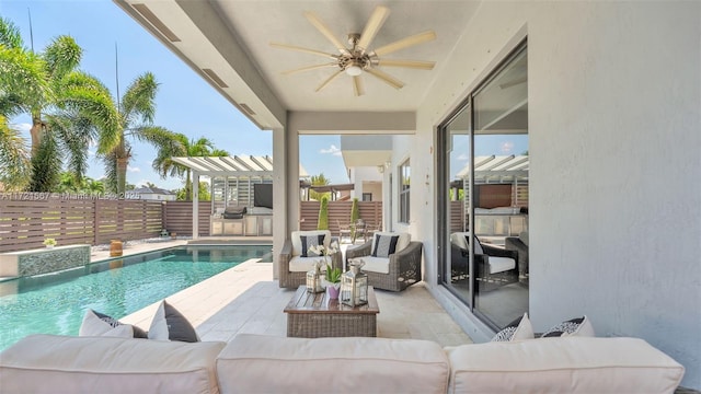 view of pool with exterior kitchen, ceiling fan, a patio area, and an outdoor hangout area