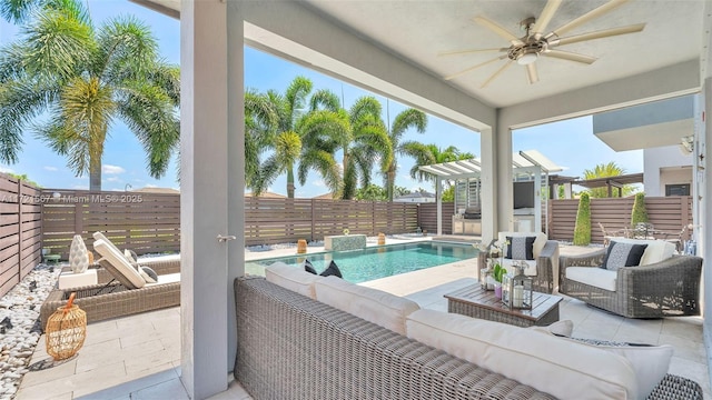 view of pool with an outdoor living space, a patio, ceiling fan, and a pergola