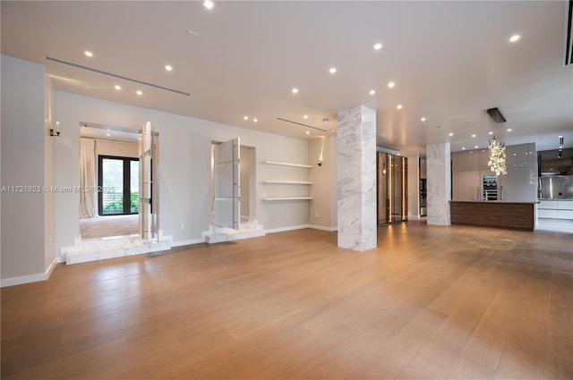 unfurnished living room featuring light hardwood / wood-style floors